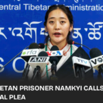 Namkyi, a former Tibetan political prisoner, speaks out in Dharamshala about her harsh experiences and the critical need for unity among Tibetans worldwide.